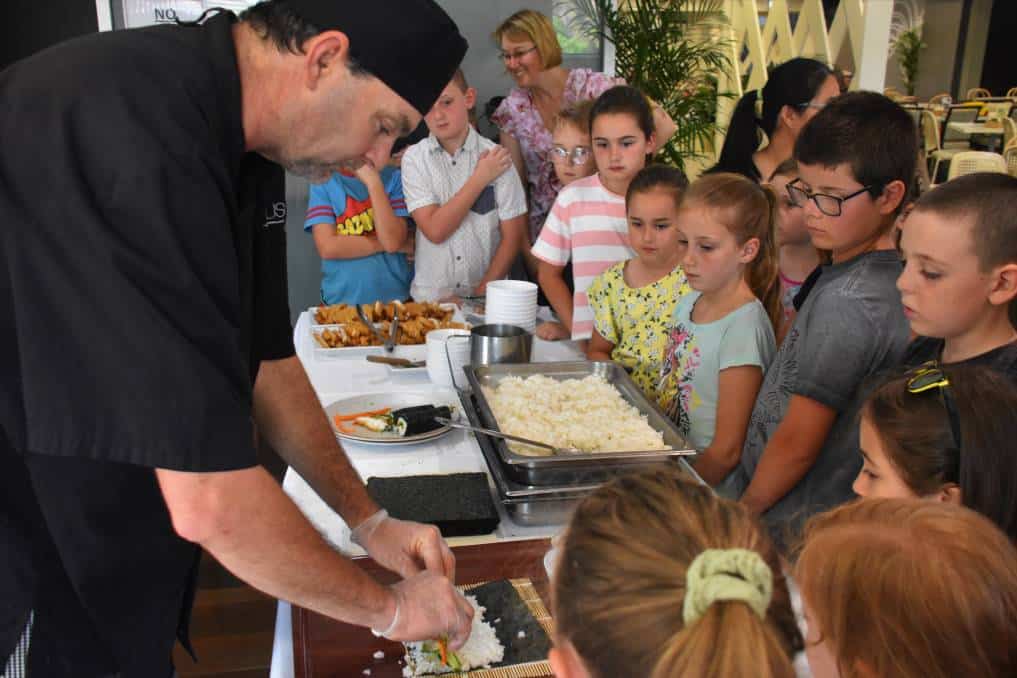 Featured image for “Laurieton United Services Club head chef Jason Bird teaches kids how to make sushi during school holidays”