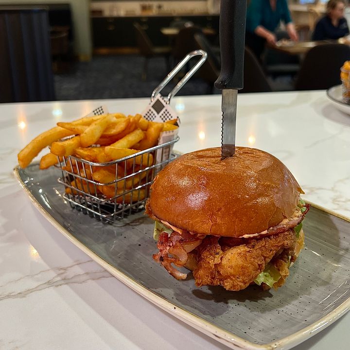 Featured image for “Introducing our Southern Fried Chicken Burger!  Packed with fresh lettuce, crispy bacon, melted cheese, and spicy habanero mayo! Served with irresistible chips, it’s the ultimate lunchtime indulgence you won’t want to miss!  (Available for lunch only) #wp”